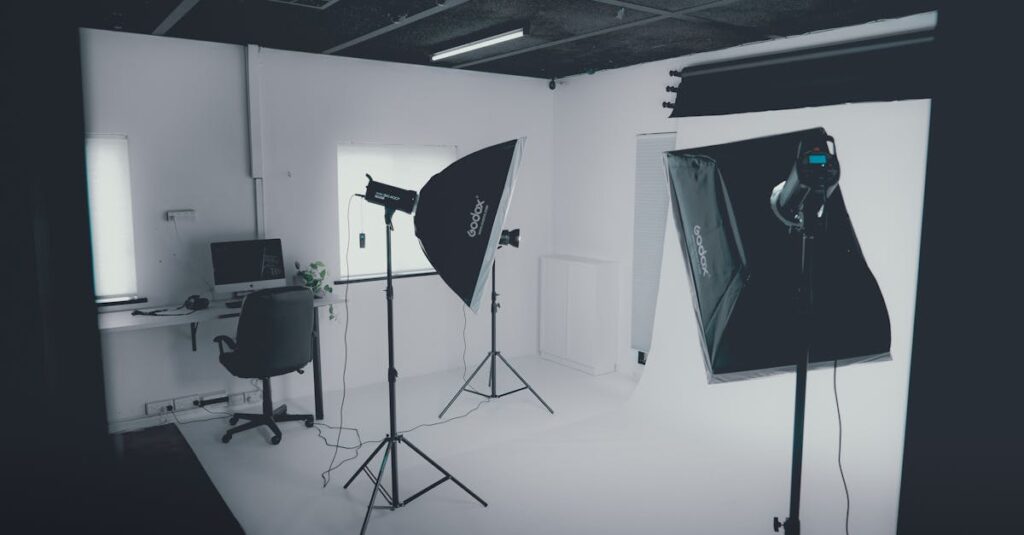 a modern photography studio with professional lighting equipment and a computer workstation